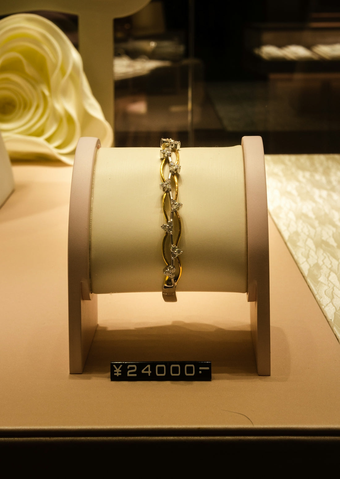 a display case with a bracelet on it