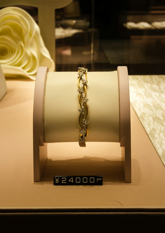 a display case with a bracelet on it
