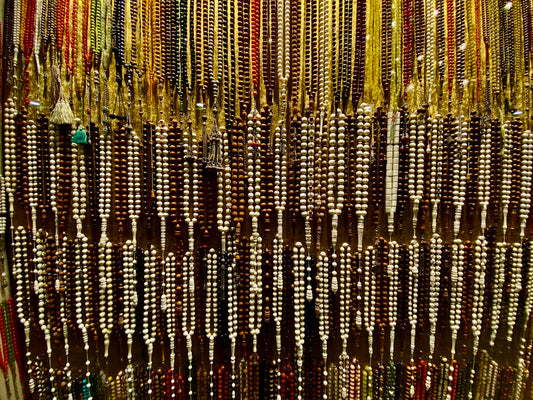 a display of beads and necklaces in a store